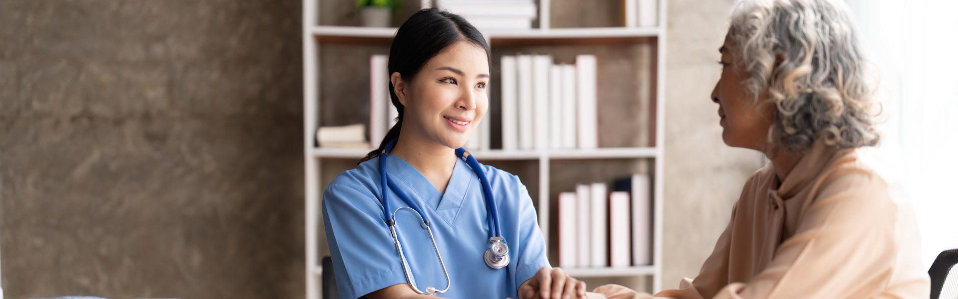 caregiver looking at elderly