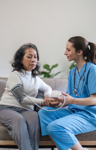 caregiver checking elderly