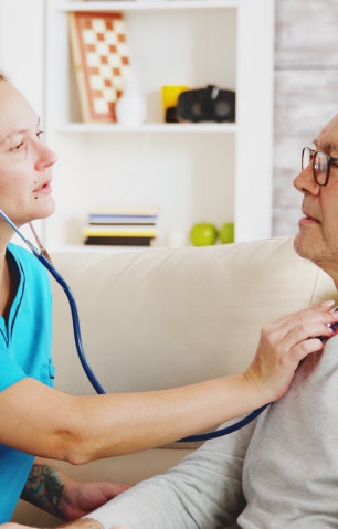 caregiver checking elderly
