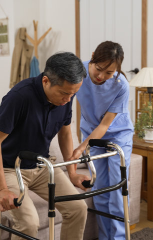 caregiver assisting elderly