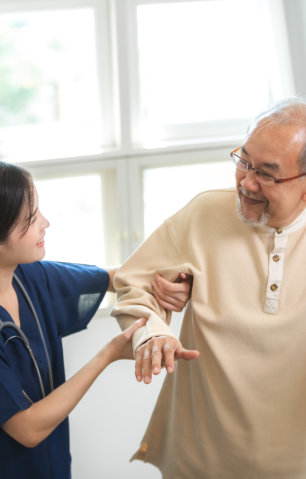 caregiver assisting elderly