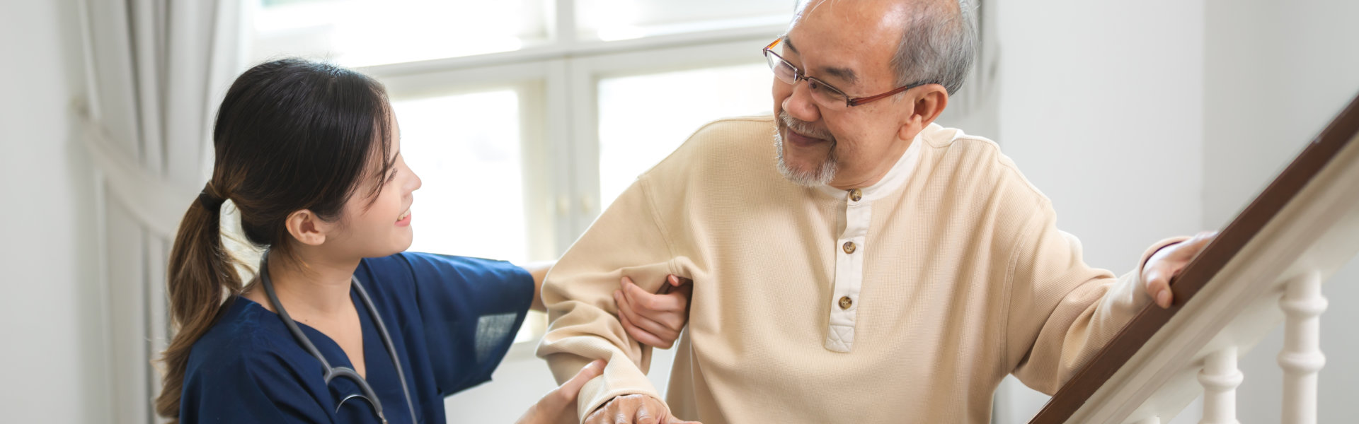 caregiver assisting elderly