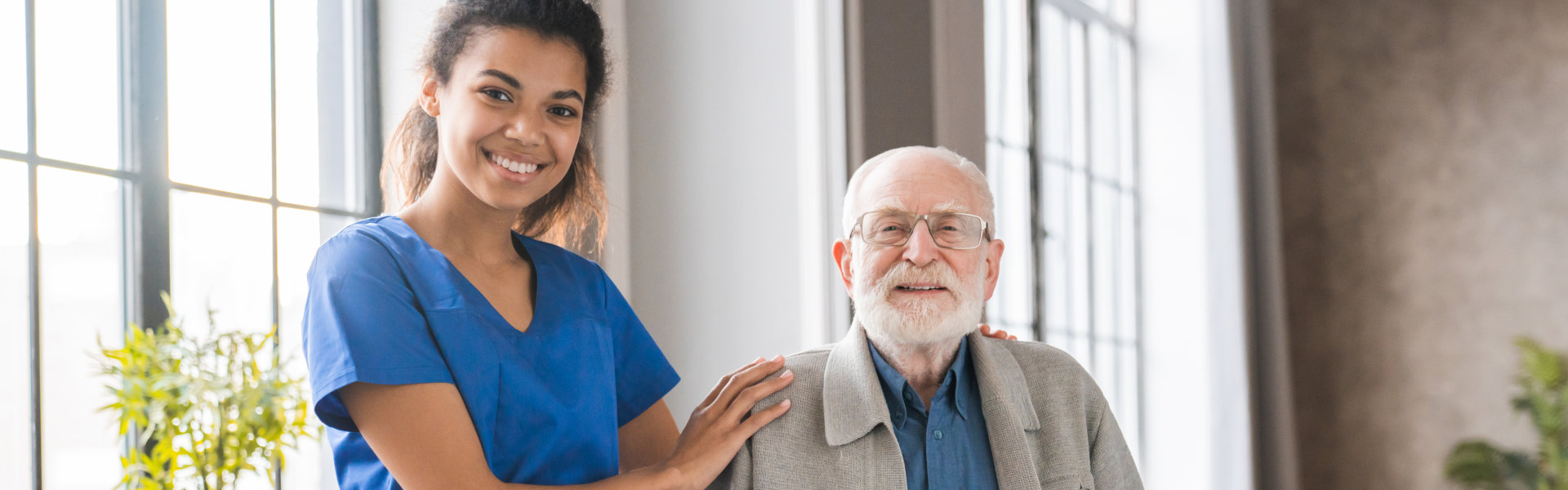 caregiver and elderly smiling